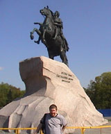 Marc in front of statue of St. Peter on horseback